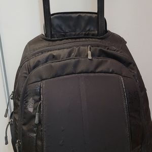 Black Mec Mountain Equipment Co-op rolling backpack carry on laptop bag $100